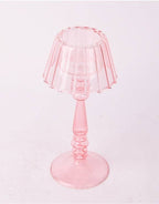 Close up of glass light pink Lamp style tealight holder 