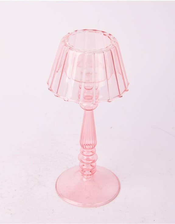 Close up of glass light pink Lamp style tealight holder 