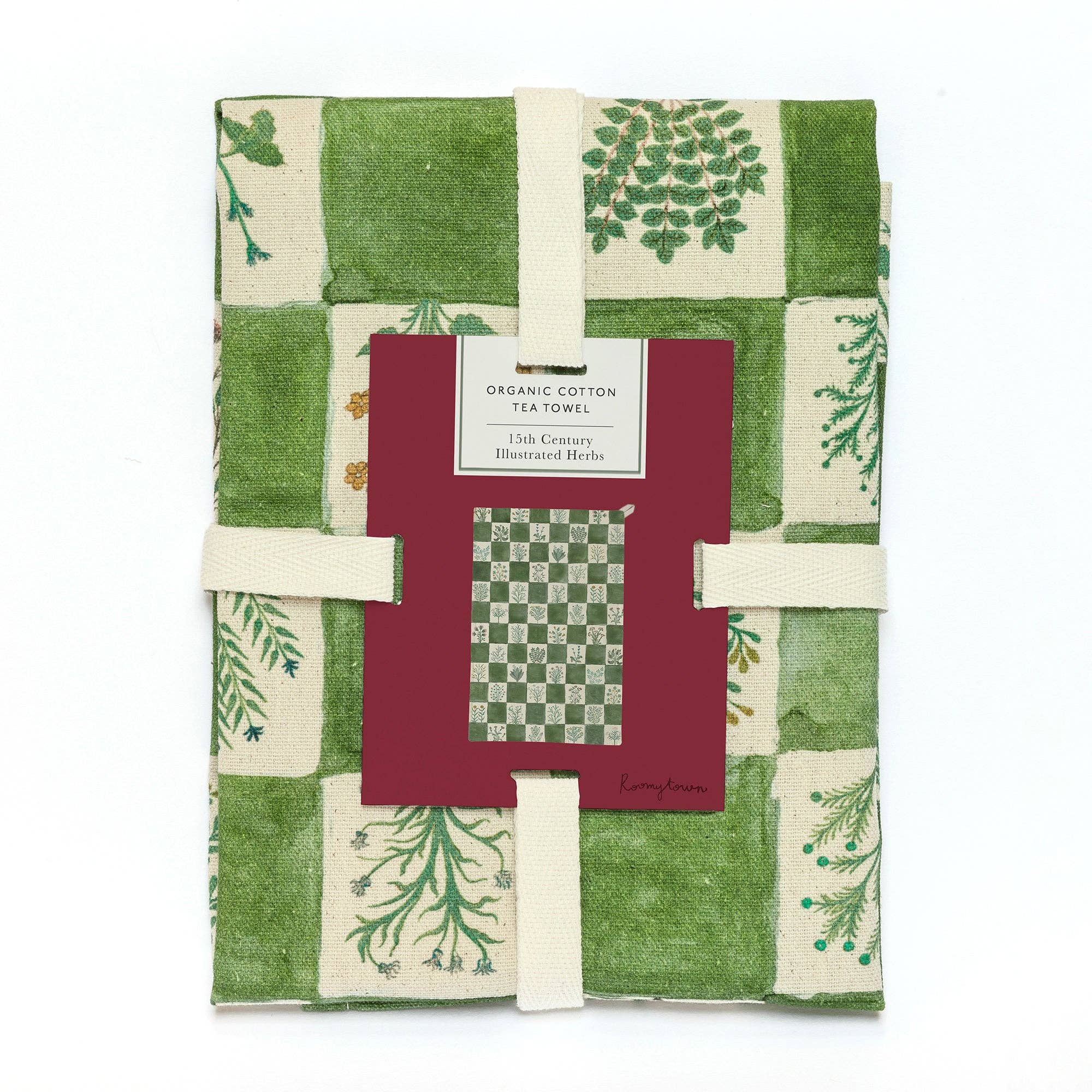 A green and white checkered organic cotton tea towel with herb botanical llustrations. The tea towel is wrapped ready for gifting.