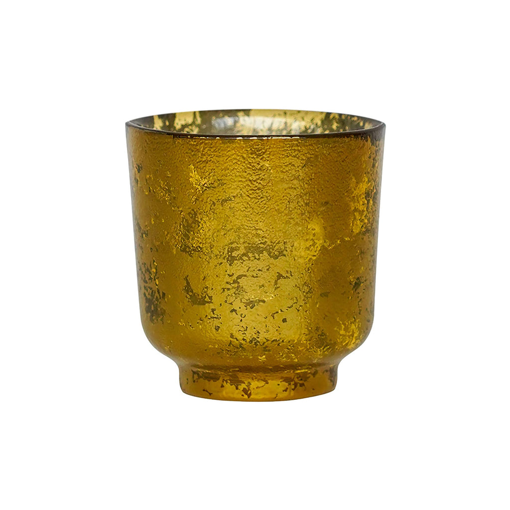 Studio shot of glass tealight holder showing detail of gold textured outer.