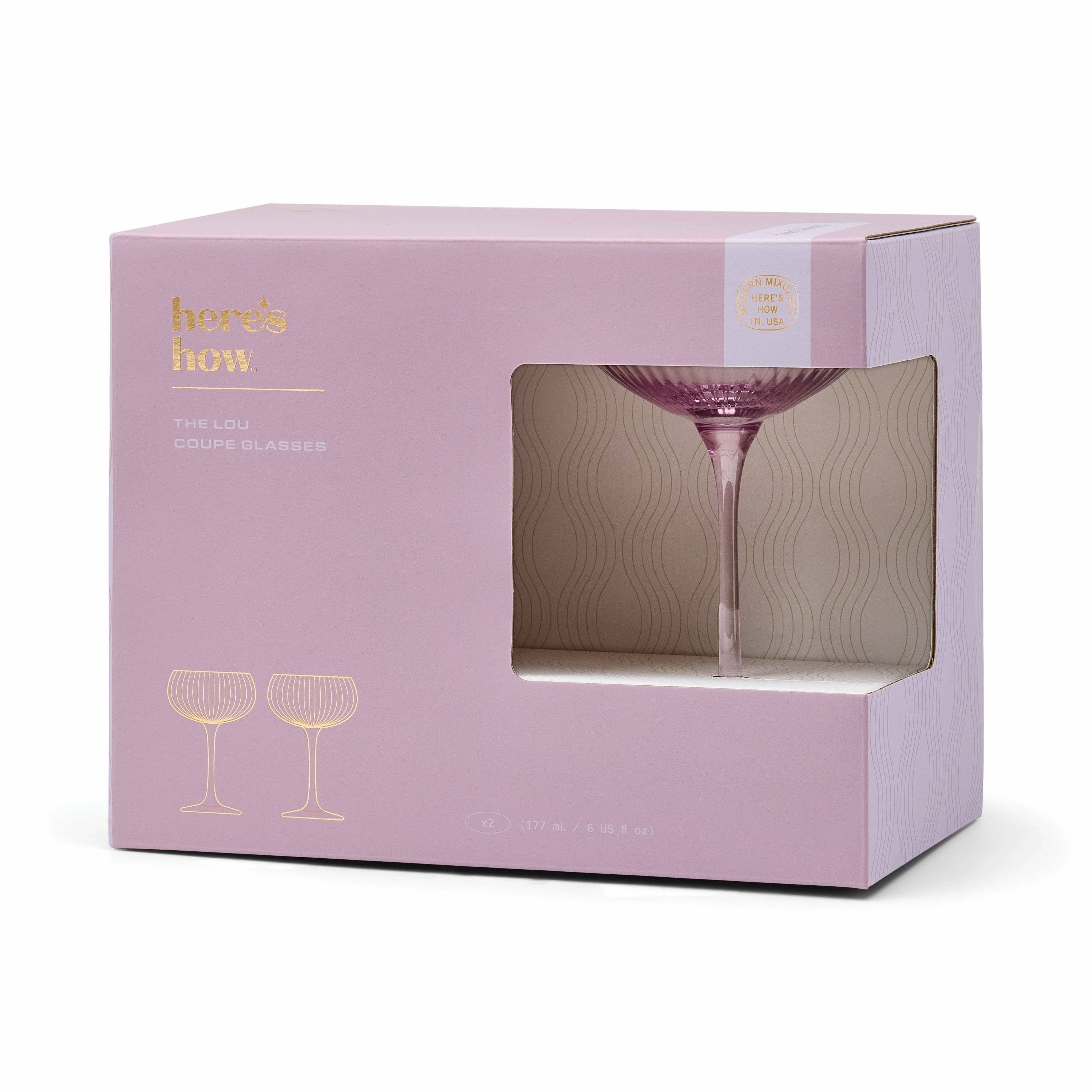 Lilac packaging box with a glass design and 'here's how' branding on a white background