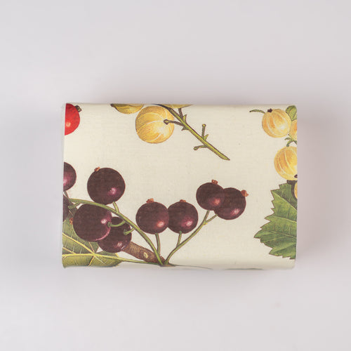 Rectangular soap with botanical illustration featuring berries and leaves on a white background.