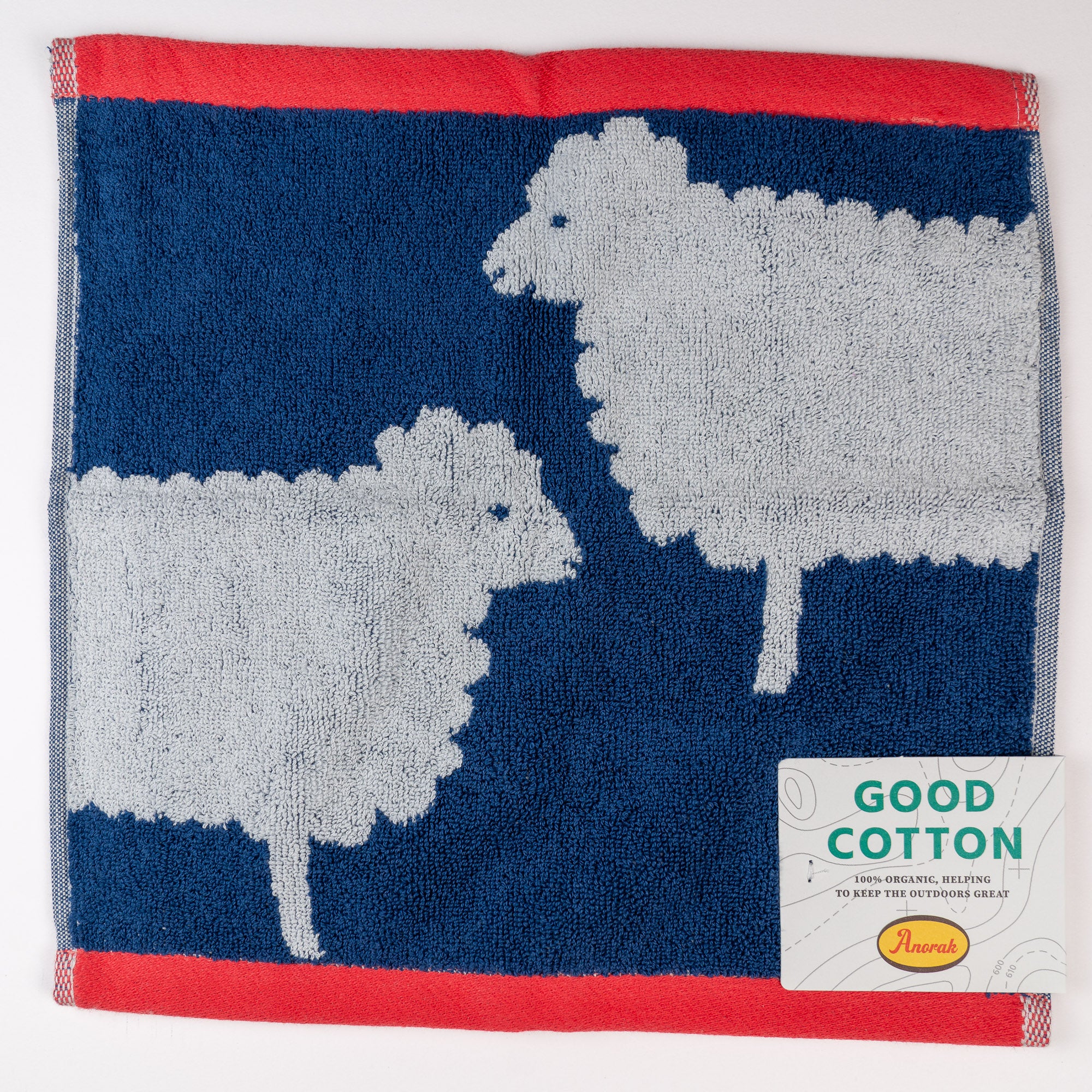 Face cloth  with sheep design and 'Good Cotton' label on a white background. Great eco conscious gift