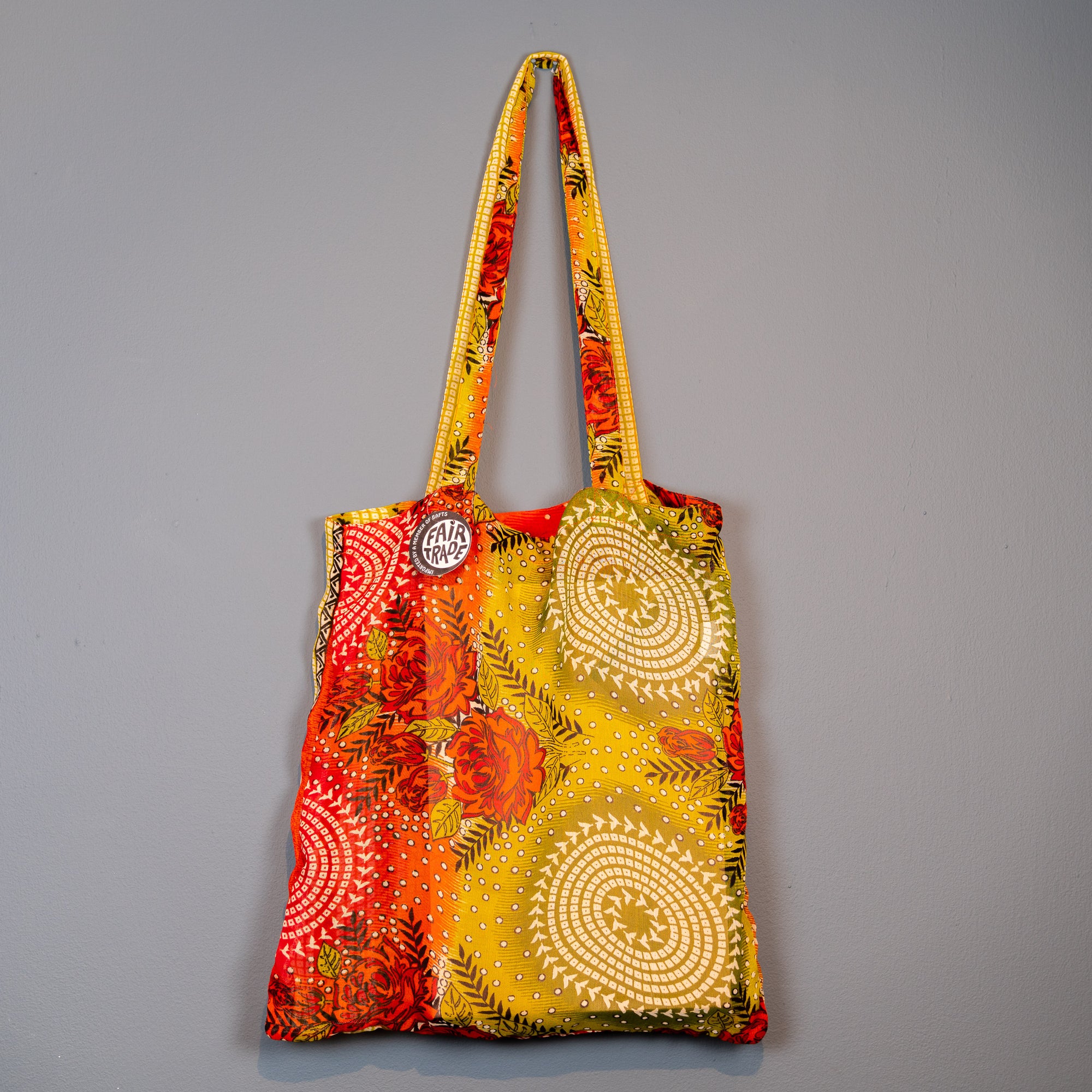 orange and mustard coloured swirl design shopper