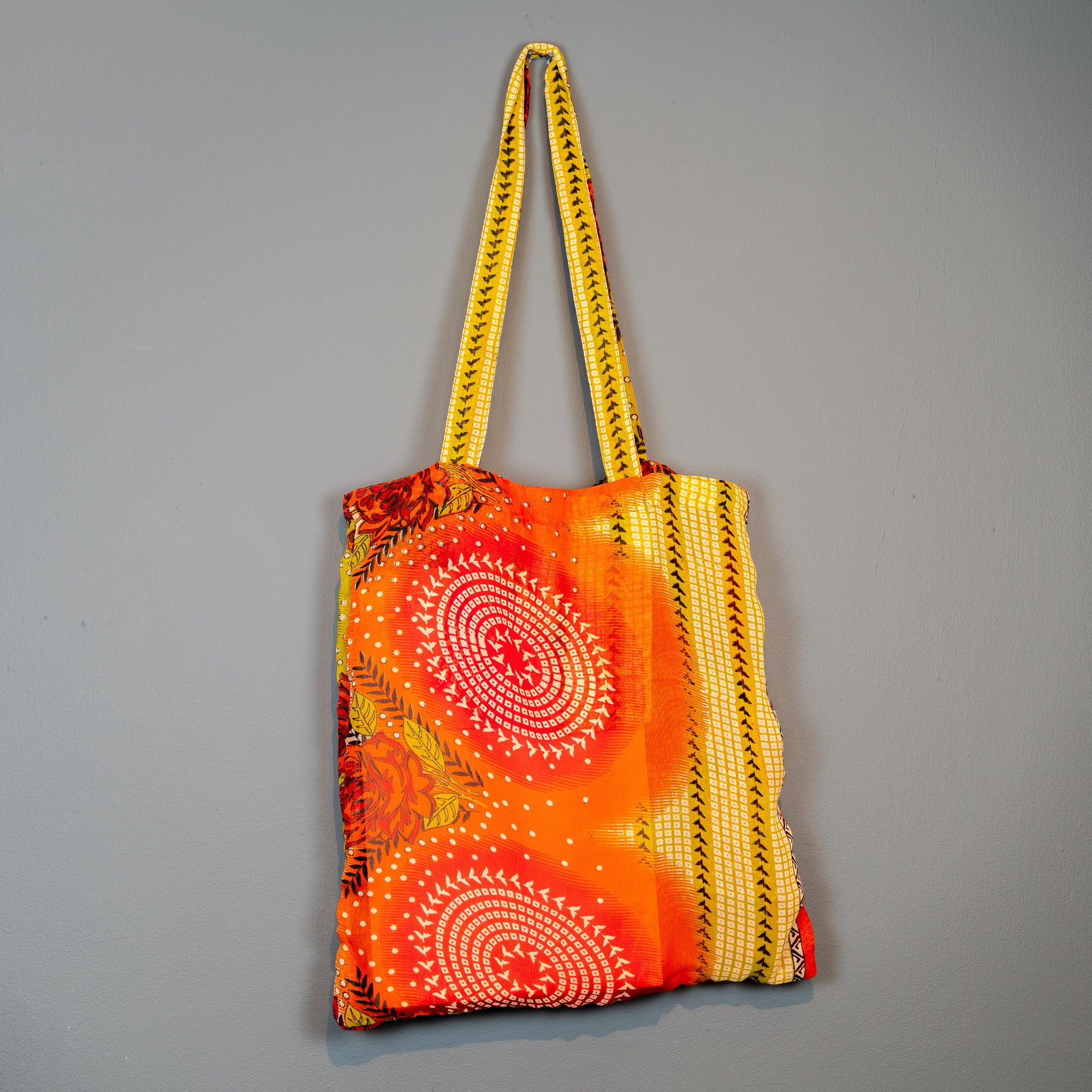 orange and mustard coloured swirl design shopper