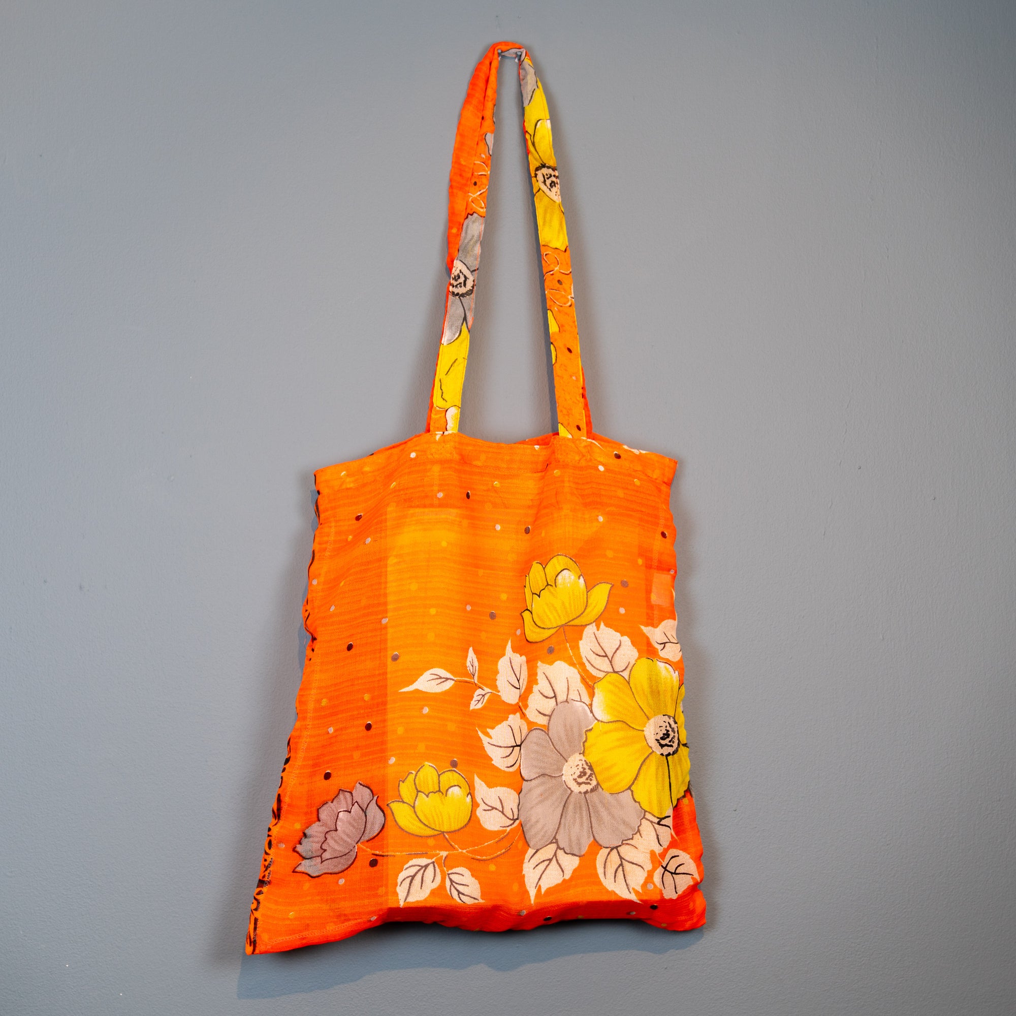 Orange flower design shopper.