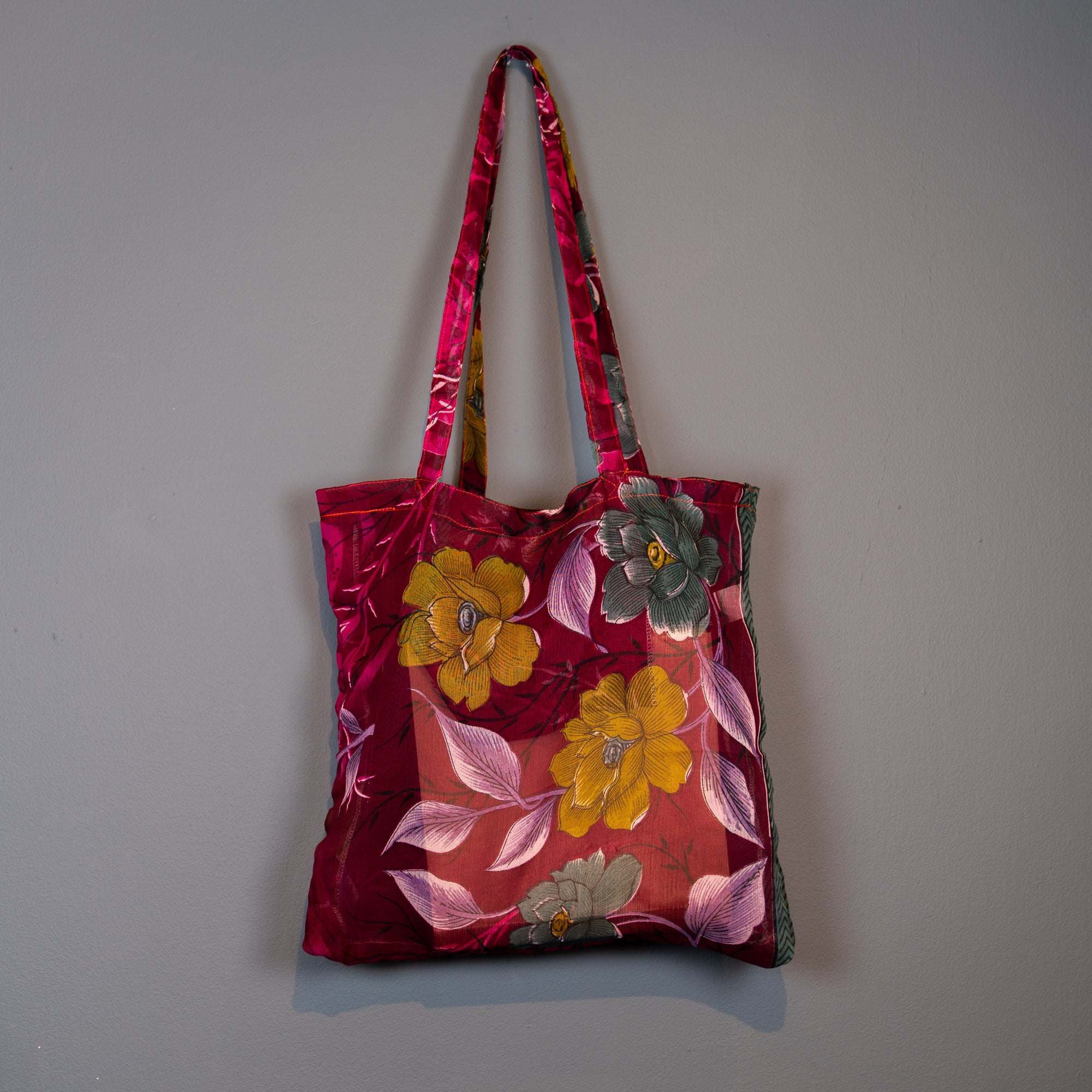 Dark red multi coloured shopper.
