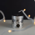 Black background with fairy lights. True Grace Manor Christmas Candle number 40 is centre shot.