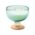 Paddywax Patchouli and Tobacco candle in resuable glass.Decorative candle in a glass holder with a gradient design on a white background