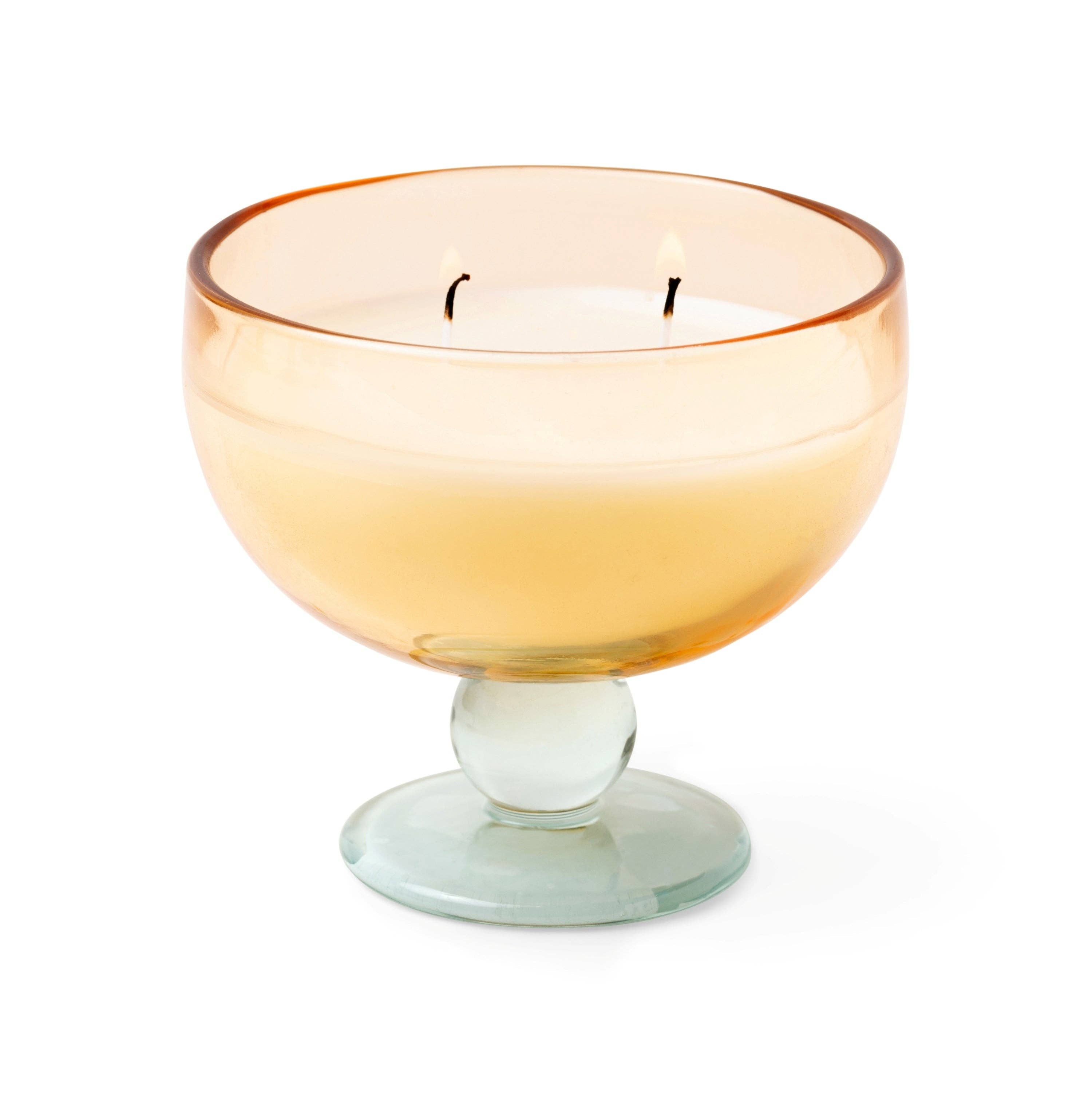Paddywax Aura Wild neroli Candle in glass. Amber and pale blue glass, double wick candle on a white background.