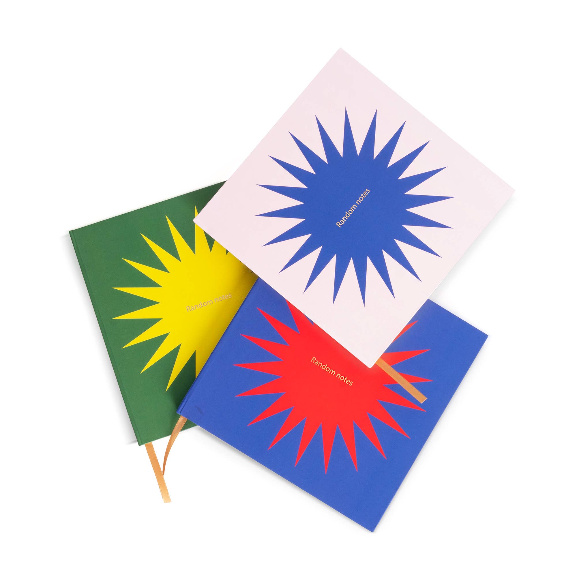 Three colorful notebooks with starburst designs on a white background